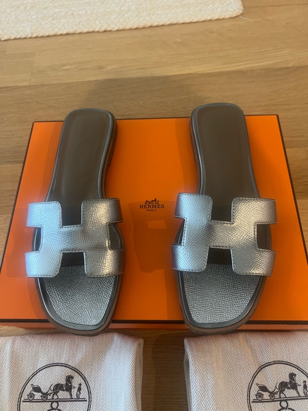 Hermes Women’s Oran Slide Sandals in Metallic Silver
